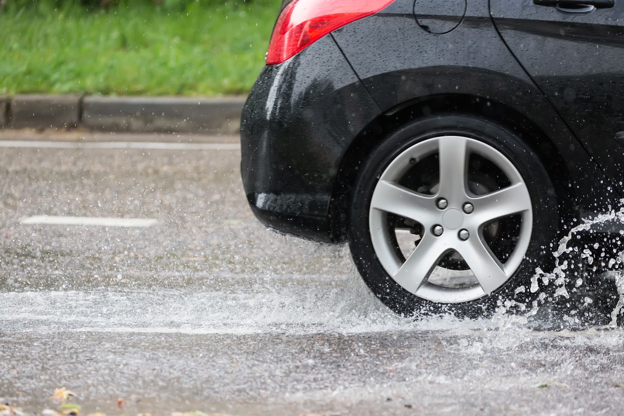 car driving through puddle of water