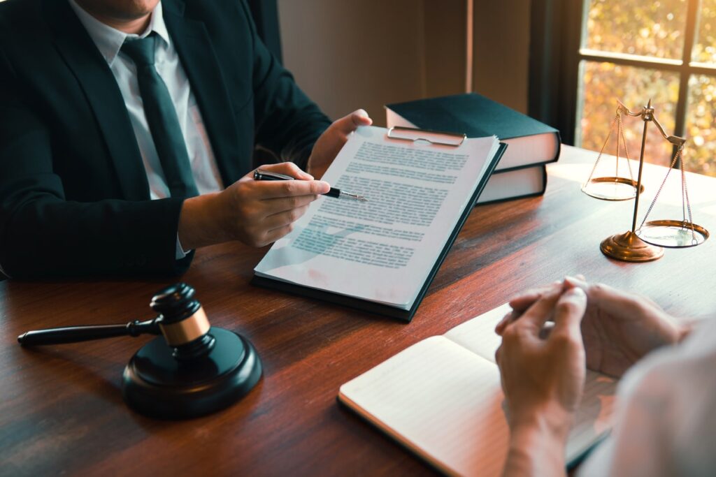 Attorney and client discussing legal options in law office
