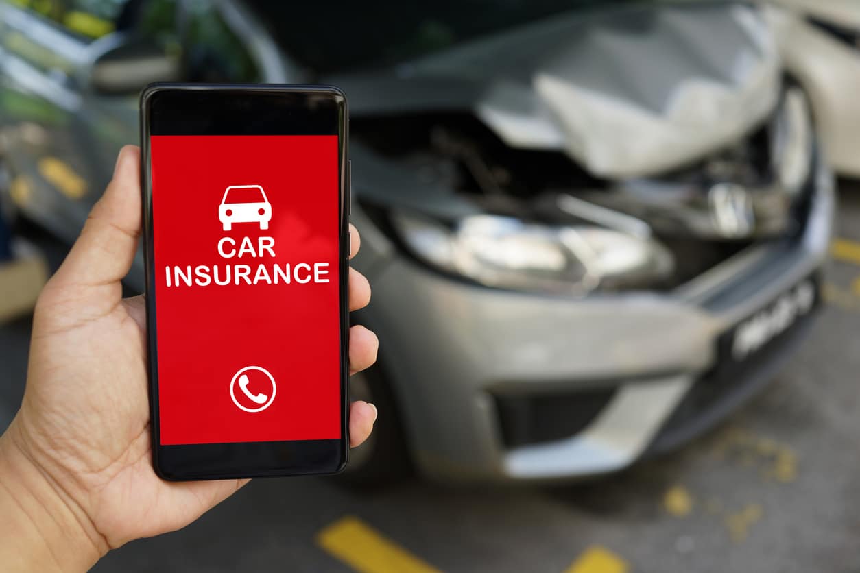 person calling their car insurance after an accident