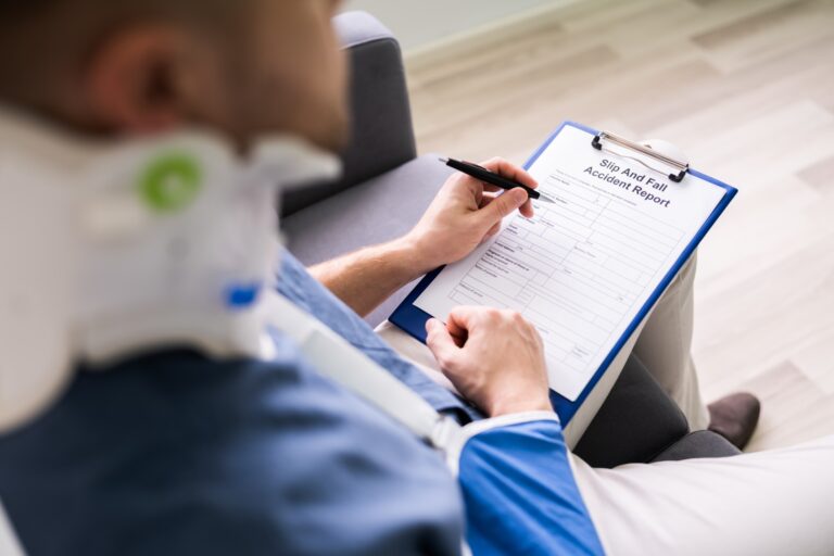 injured individual filling out a slip and fall accident report form