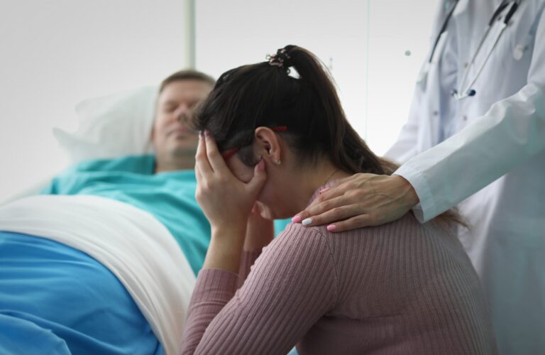 woman grieving the loss of a loved one at the hospital