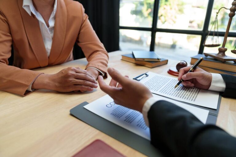 two individuals speaking about a contract