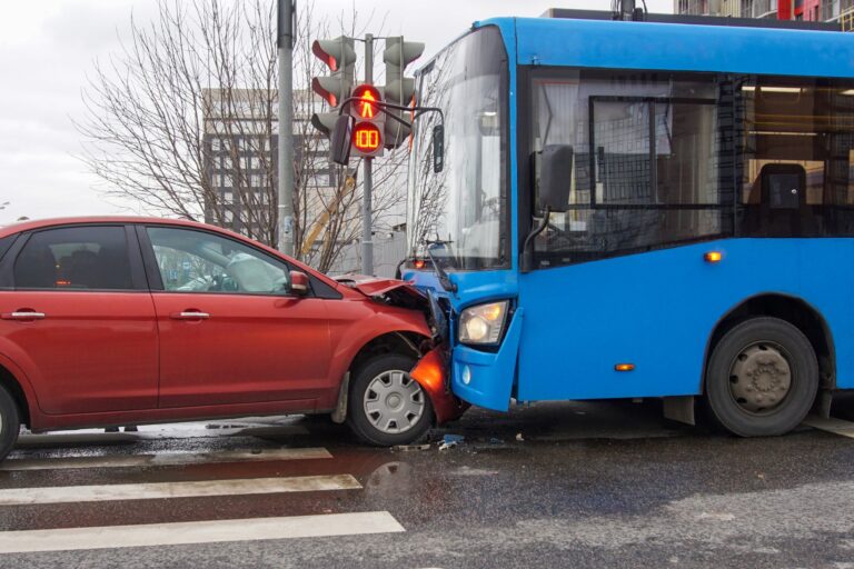 head-on collision between a passenger vehicle and a bus