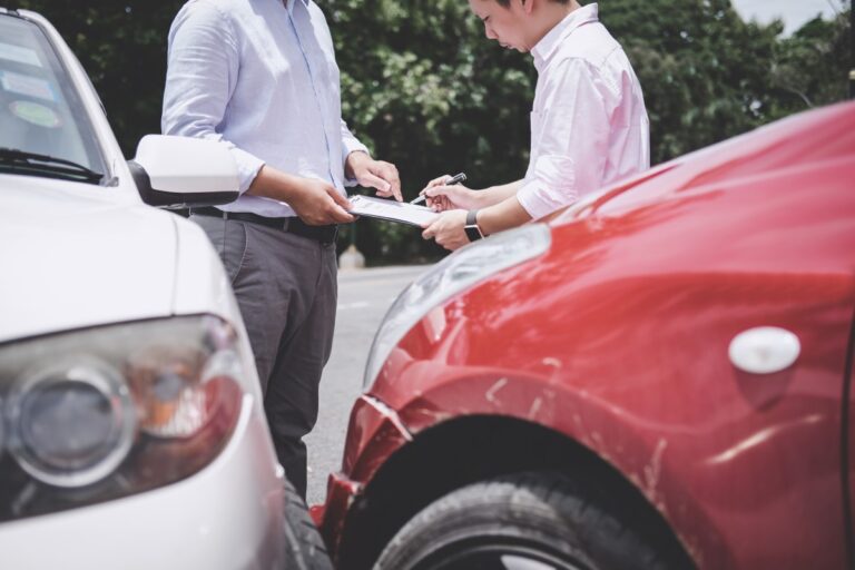two individuals exchanging information after a car crash 
