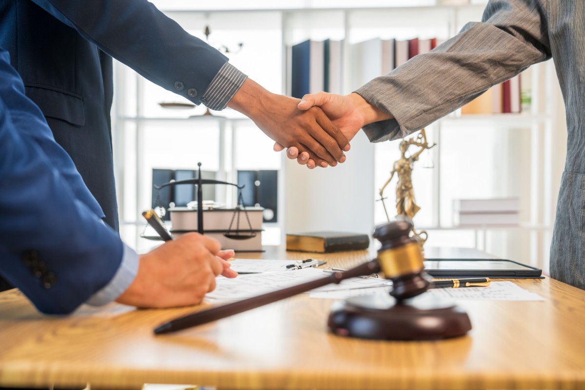 two individuals shaking hands
