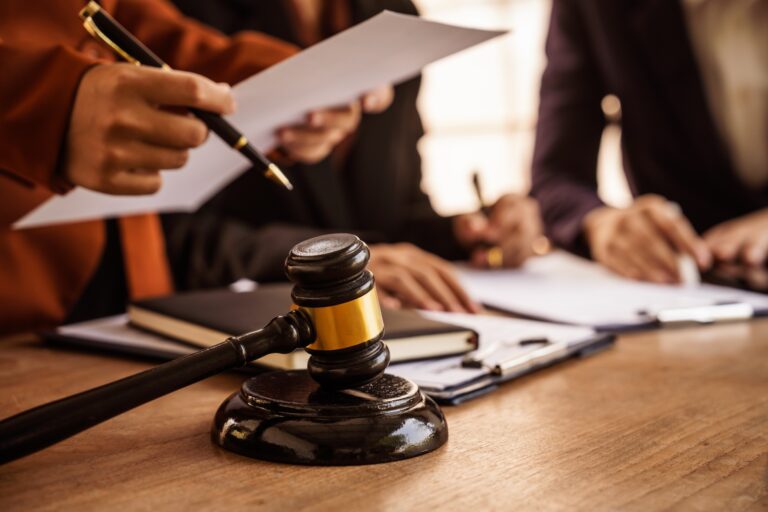 people signing legal documents