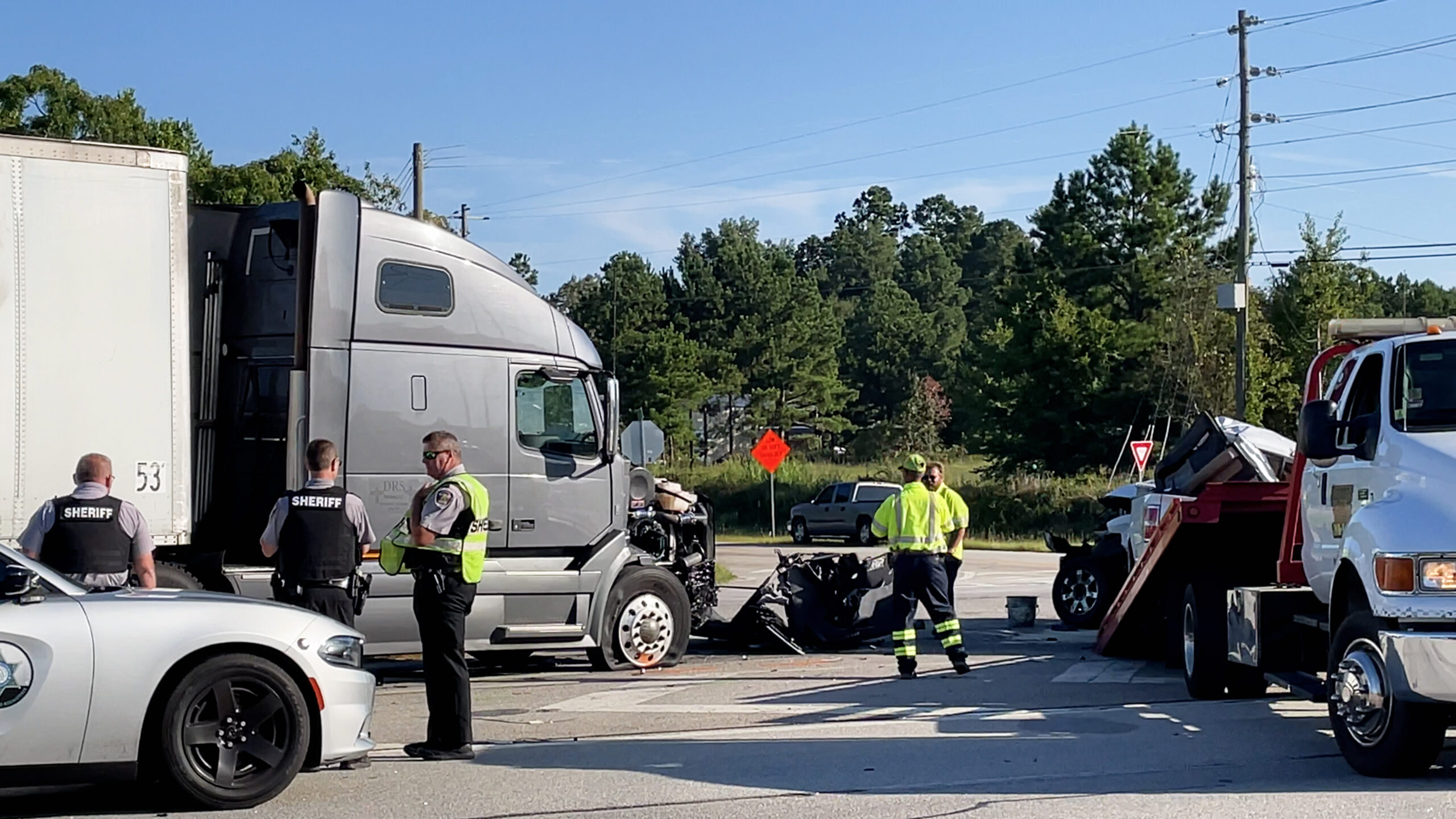 Augusta, Ga USA - 09 23 2021: Semi truck and pickup truck collision car wreck and Police officers on scene on Highway 1
